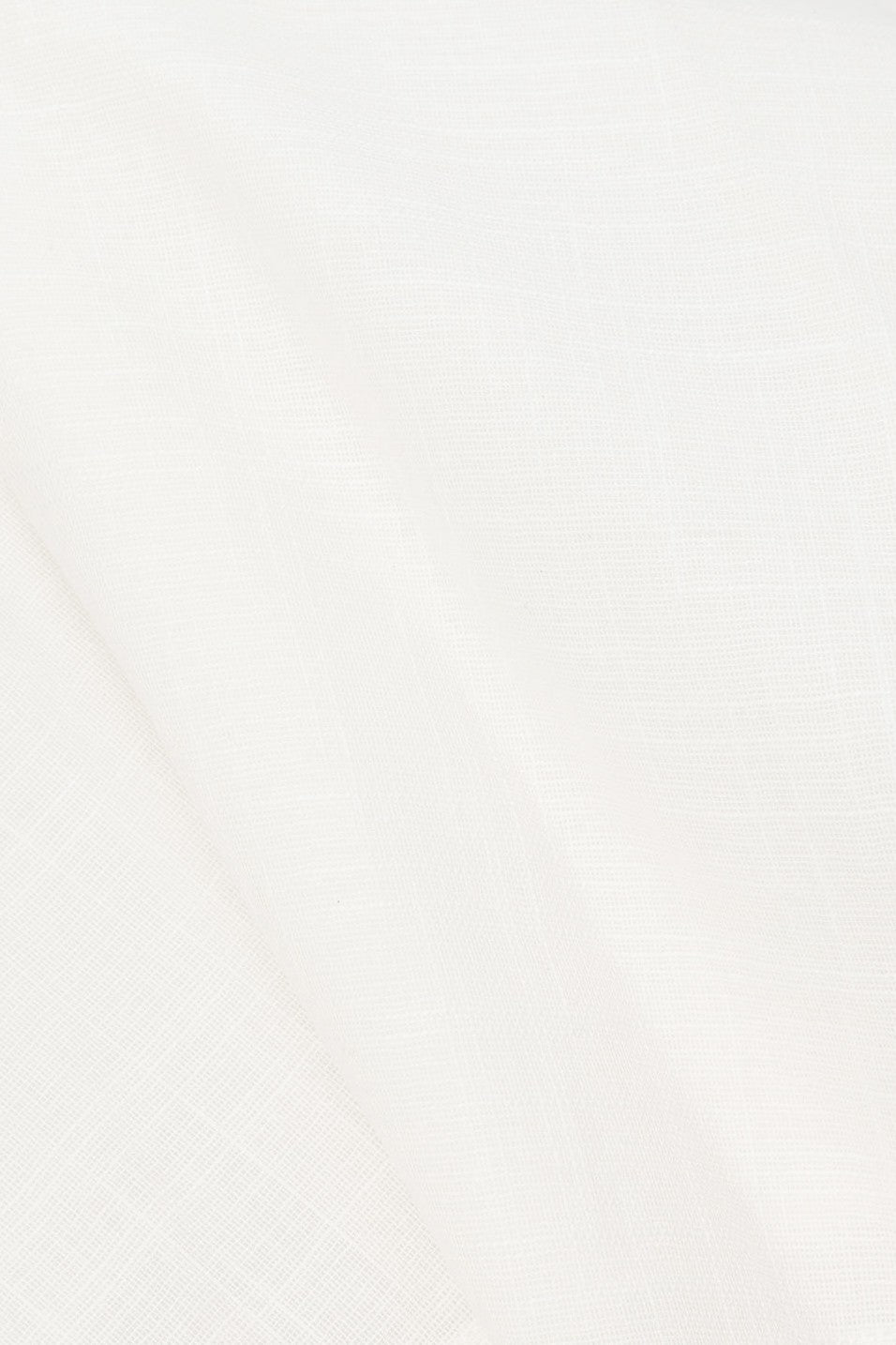 White mini dress with a boat neckline, detail view