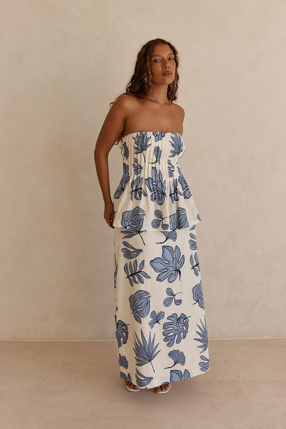 Blue maxi dress with a strapless neckline, back view