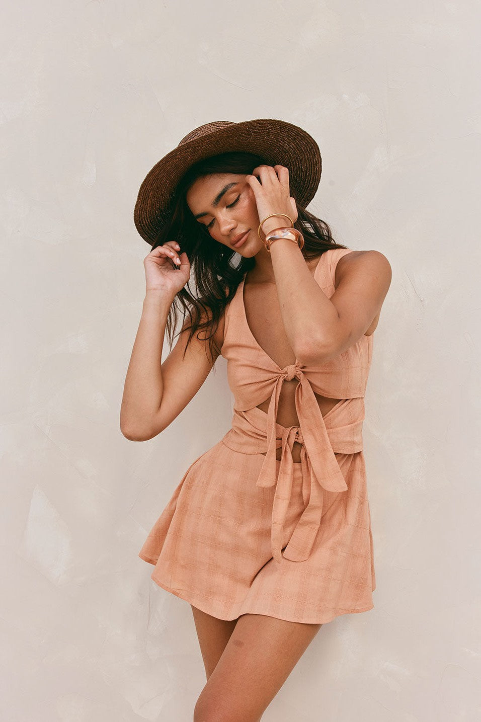 Orange mini dress with a V neckline, side view
