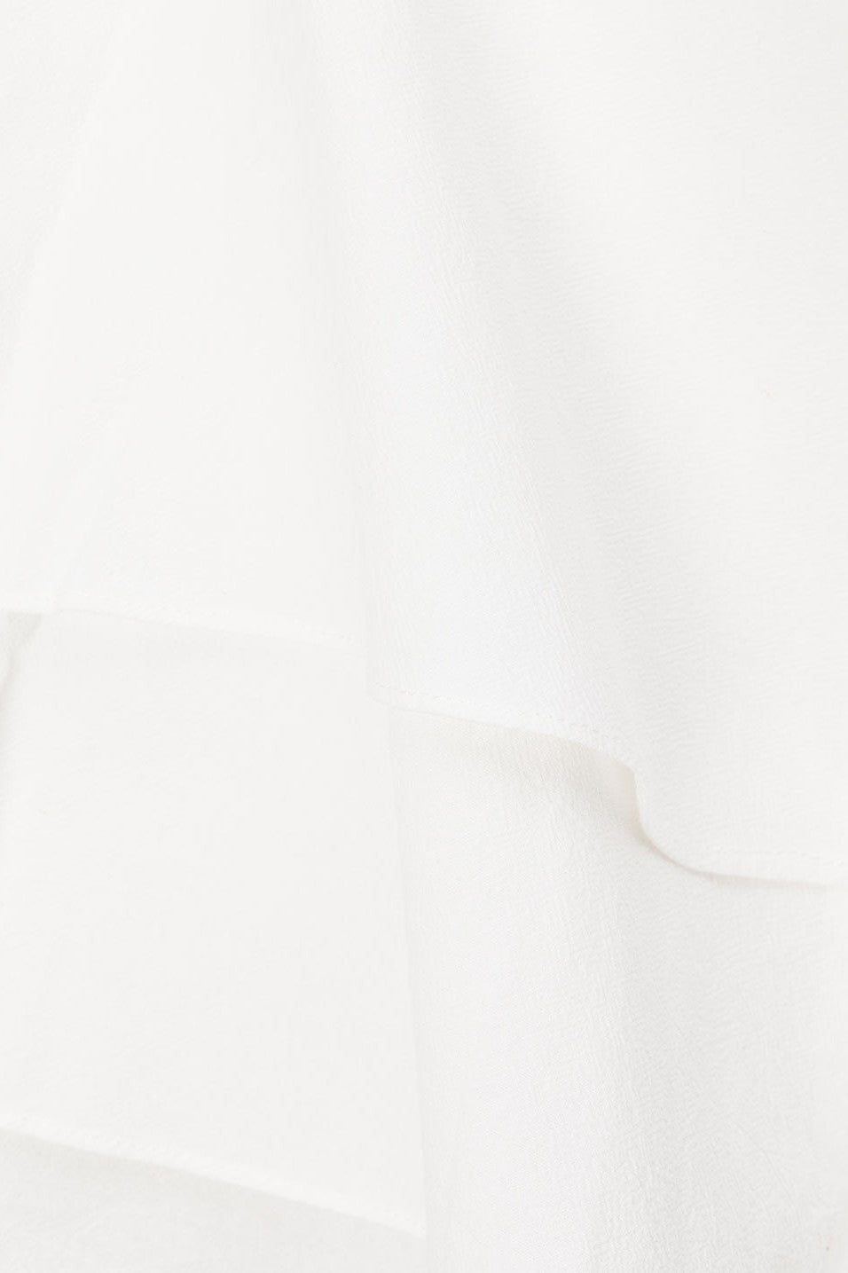 White mini dress with a strapless neckline, front view
