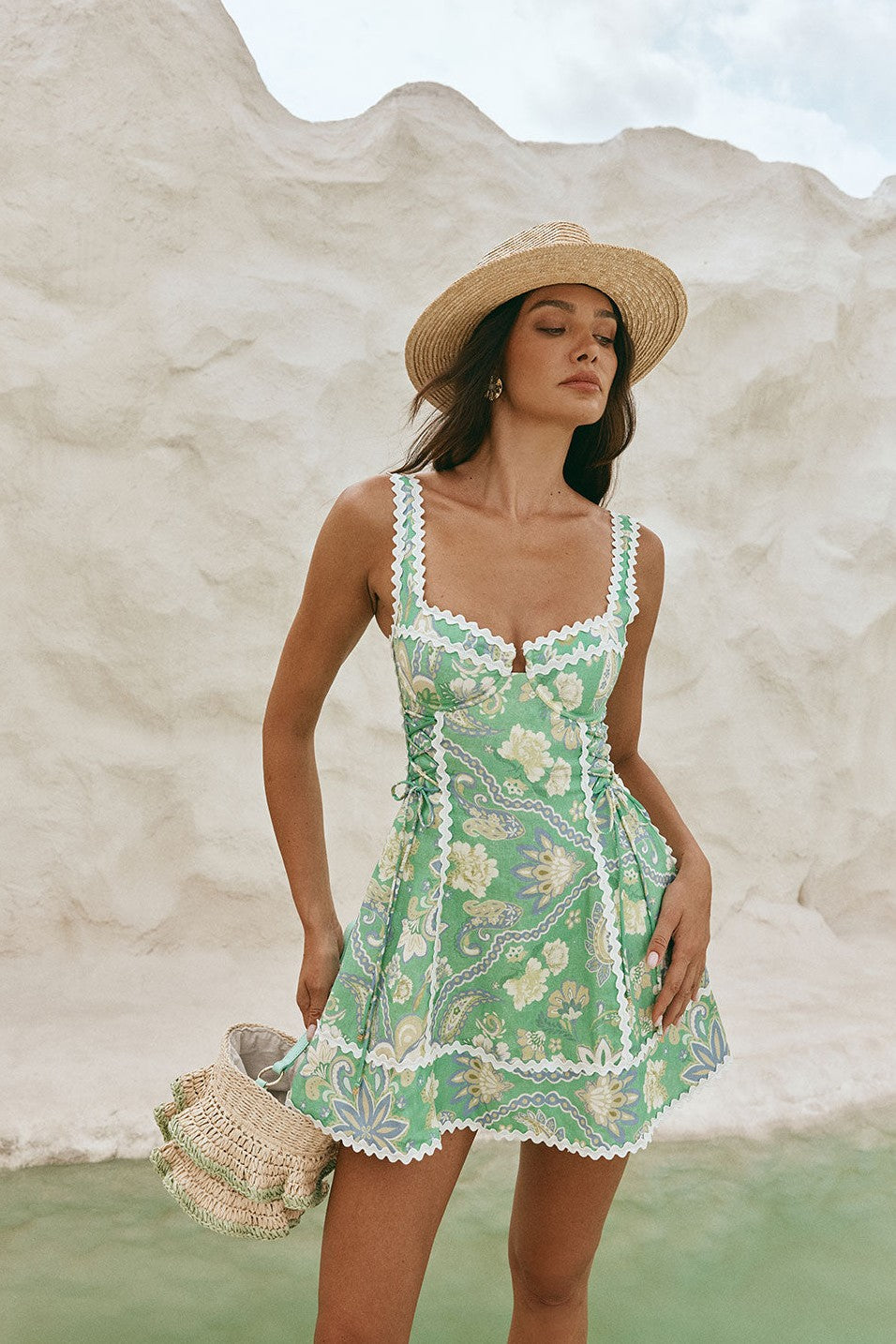 Green mini dress with an A-line skirt, detail view
