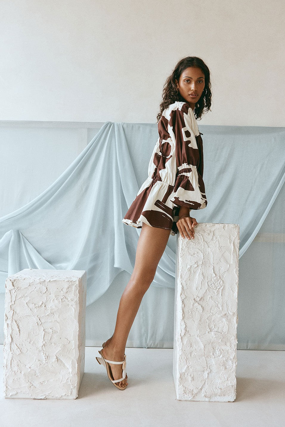 Brown mini dress with a V neckline, detail view