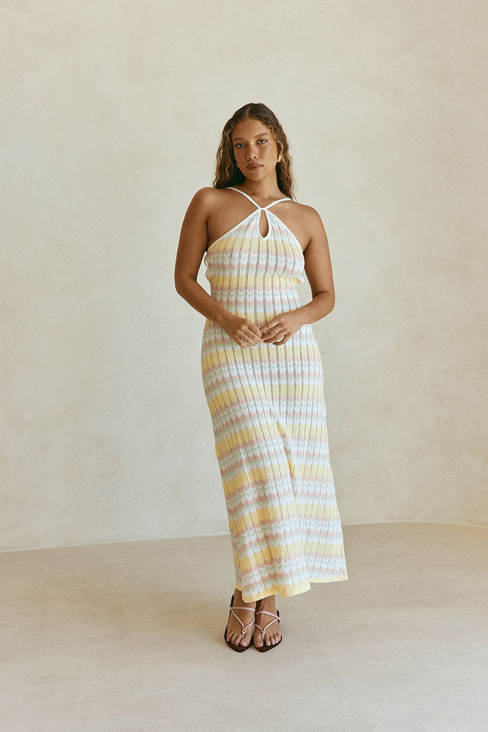 Yellow maxi dress with a halter neckline, front view