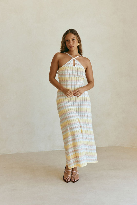 Yellow maxi dress with a halter neckline, front view