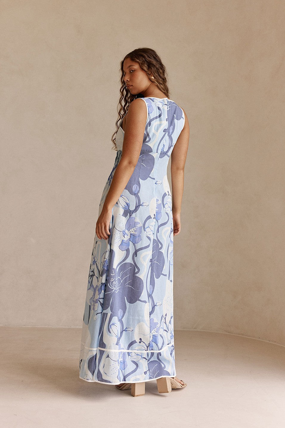 Blue maxi dress with an A-line skirt, styled on model