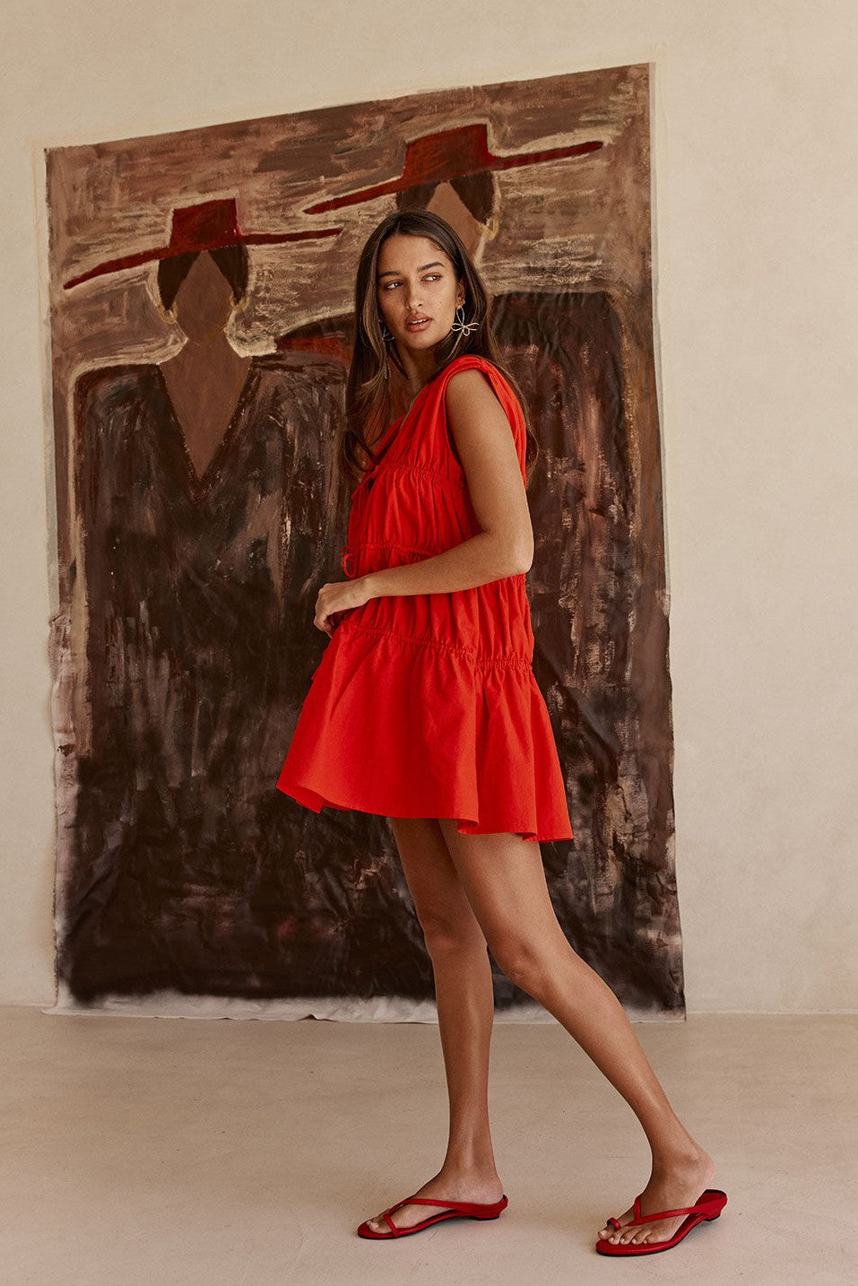 Red mini dress with a V neckline, detail view