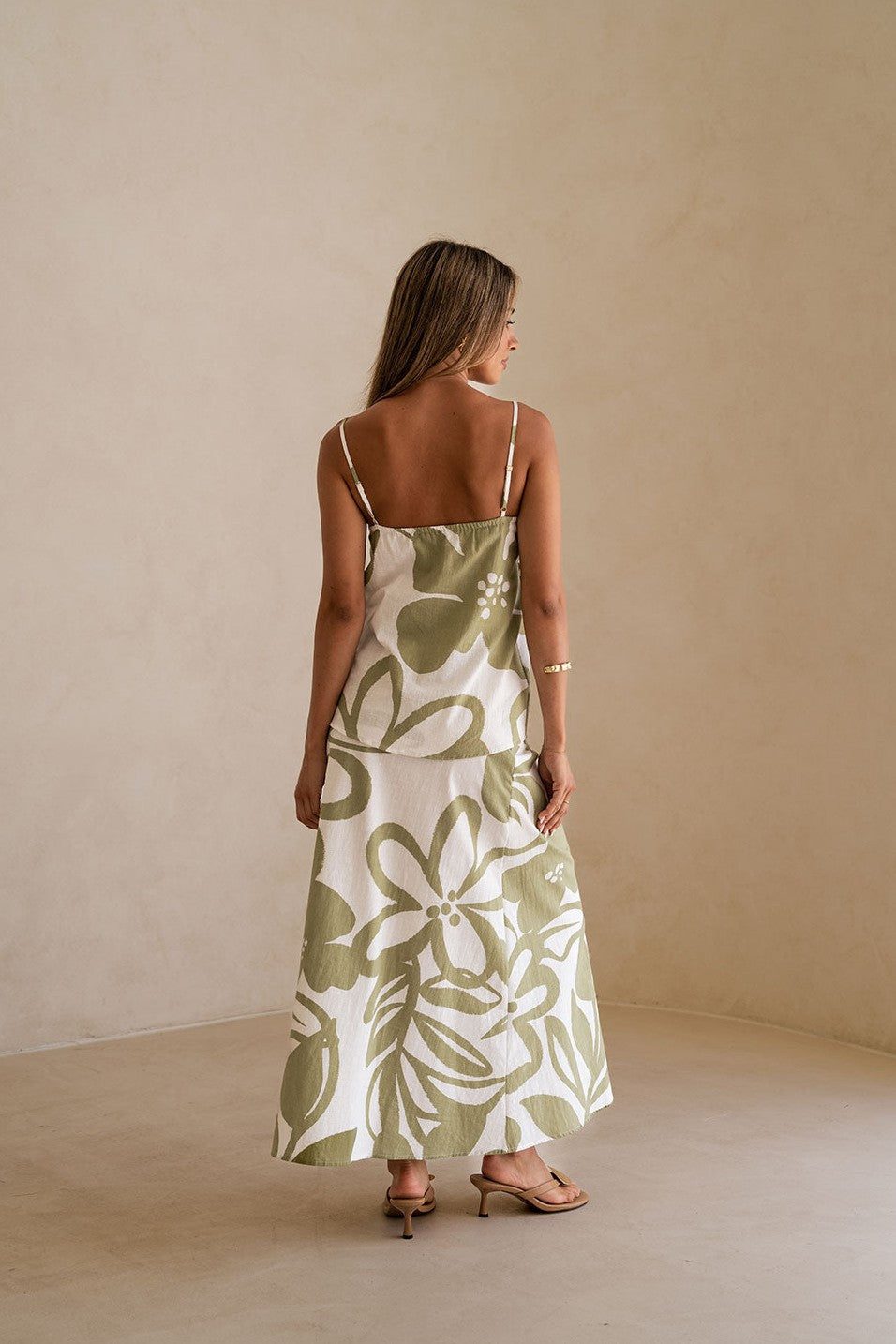 Green maxi dress with an A-line skirt, back view