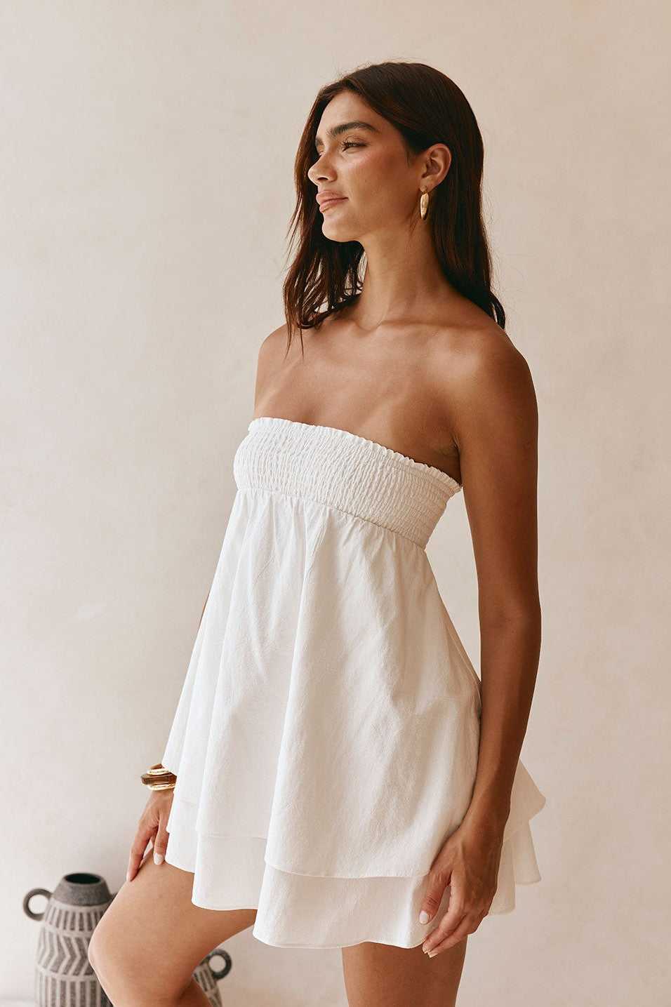White mini dress with a strapless neckline, back view
