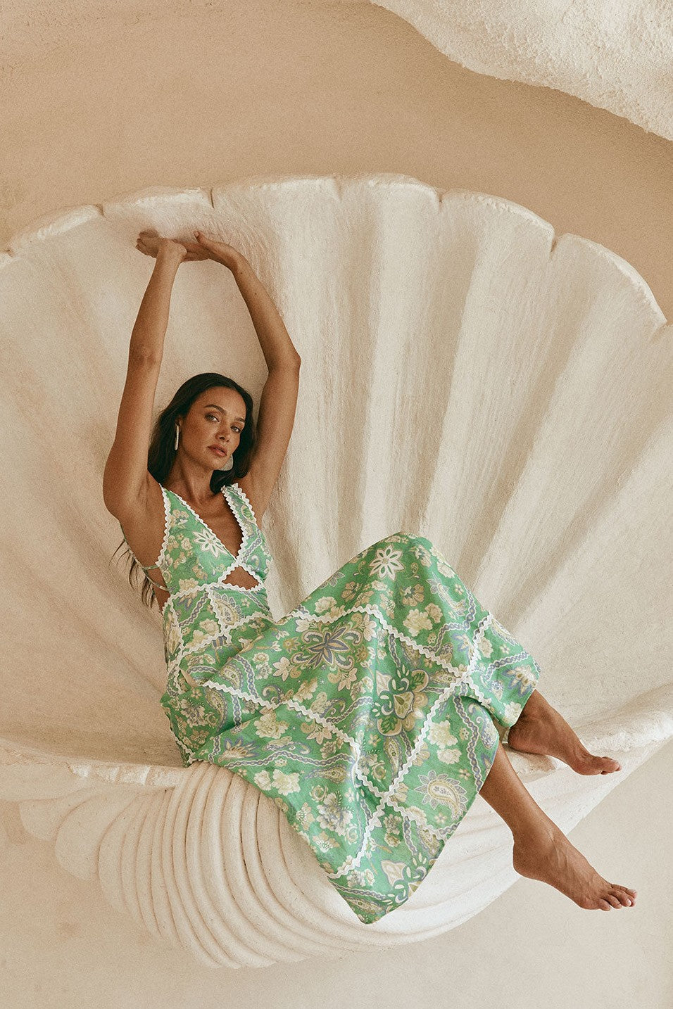 Green maxi dress with an open back, detail view