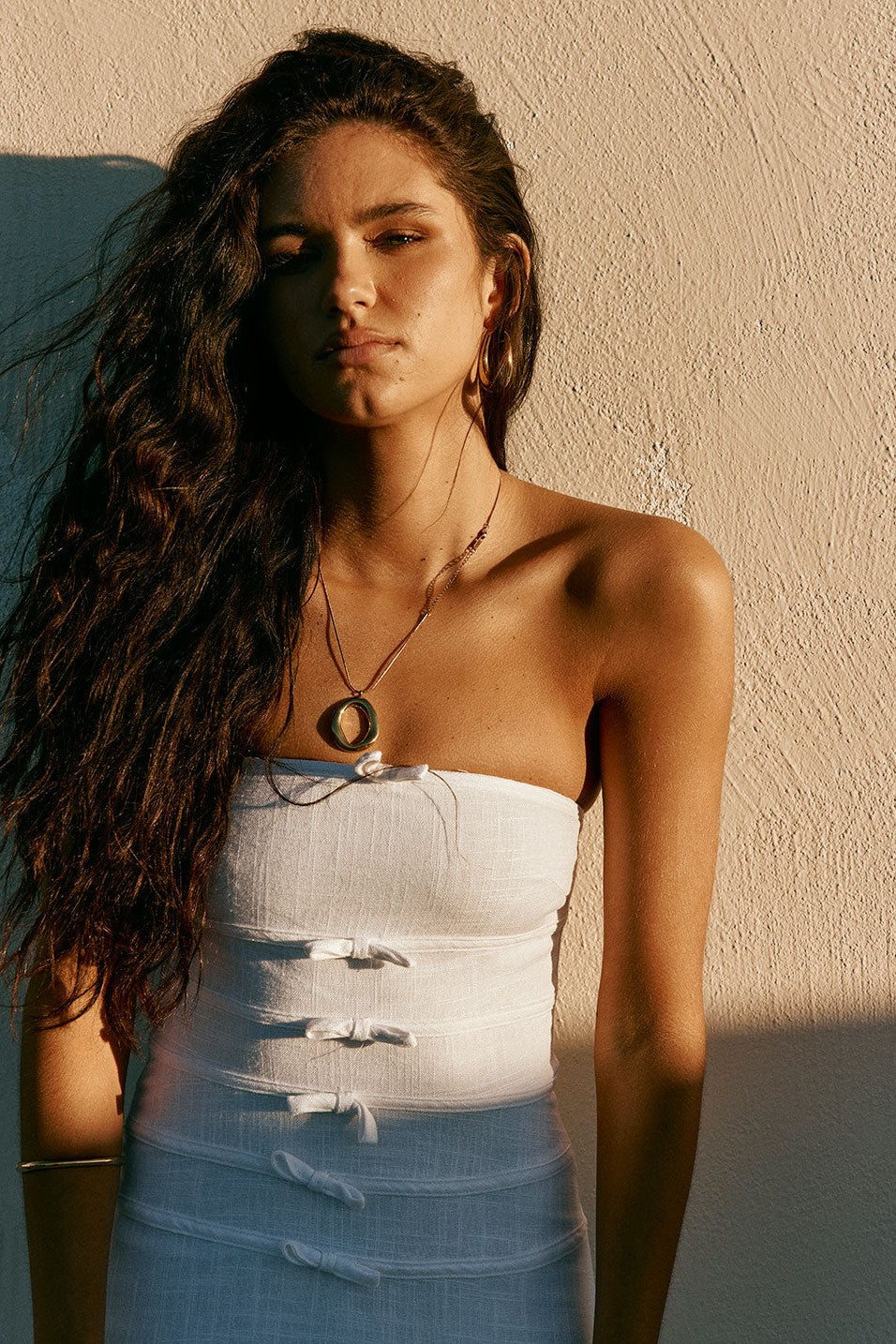 White maxi dress with a strapless neckline, back view