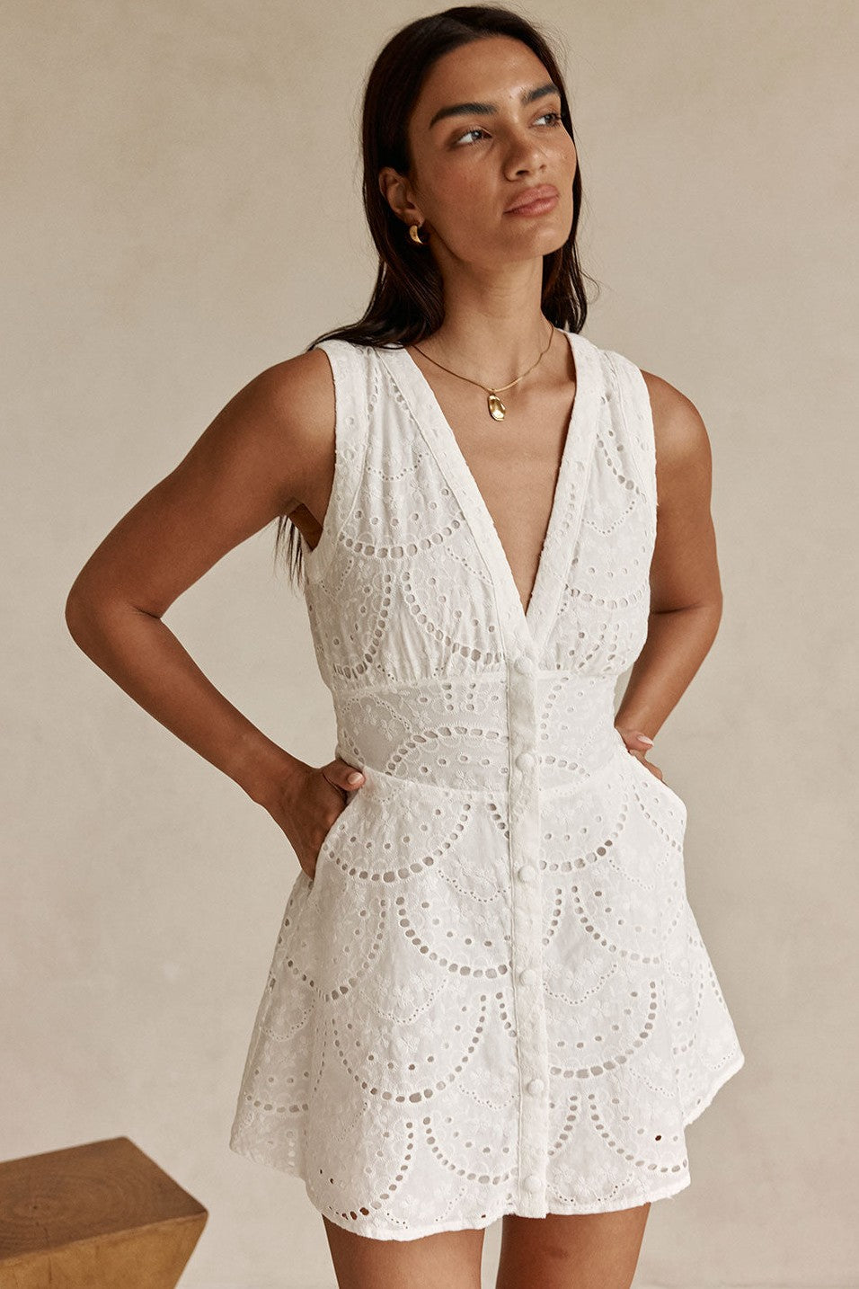 White mini dress with a plunging V neckline, front view