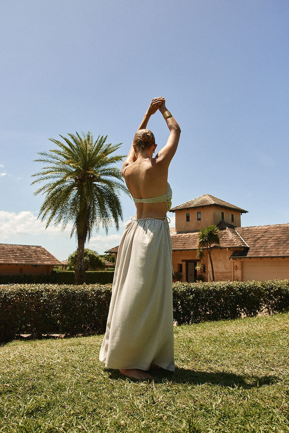 Grey maxi dress with an open back, front view