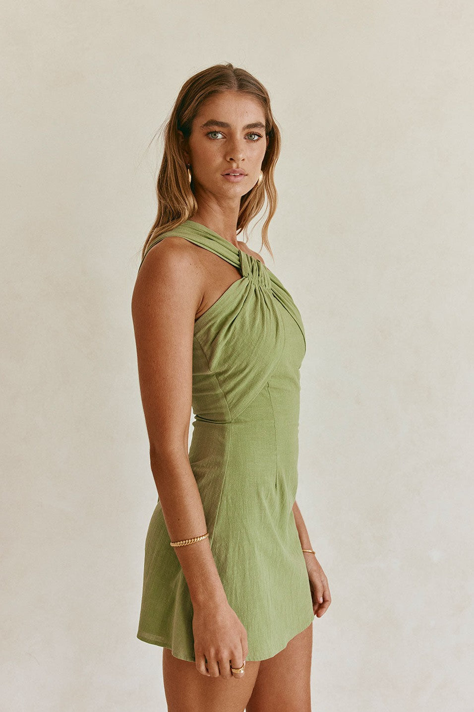 Green mini dress, side view
