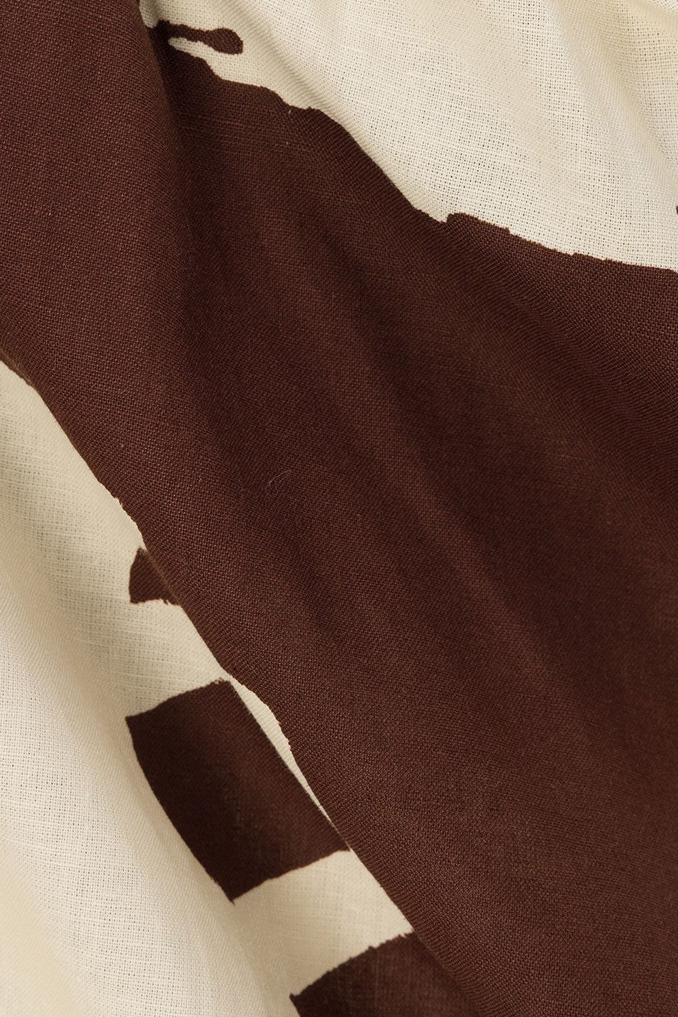 Brown mini dress with a V neckline, side view