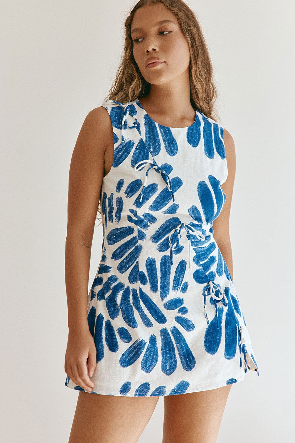 Blue mini dress with a round neckline, back view