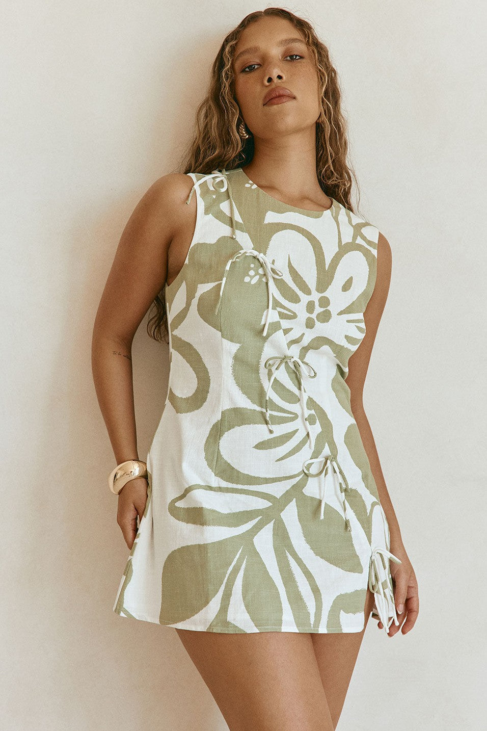 Green mini dress with a round neckline, side view