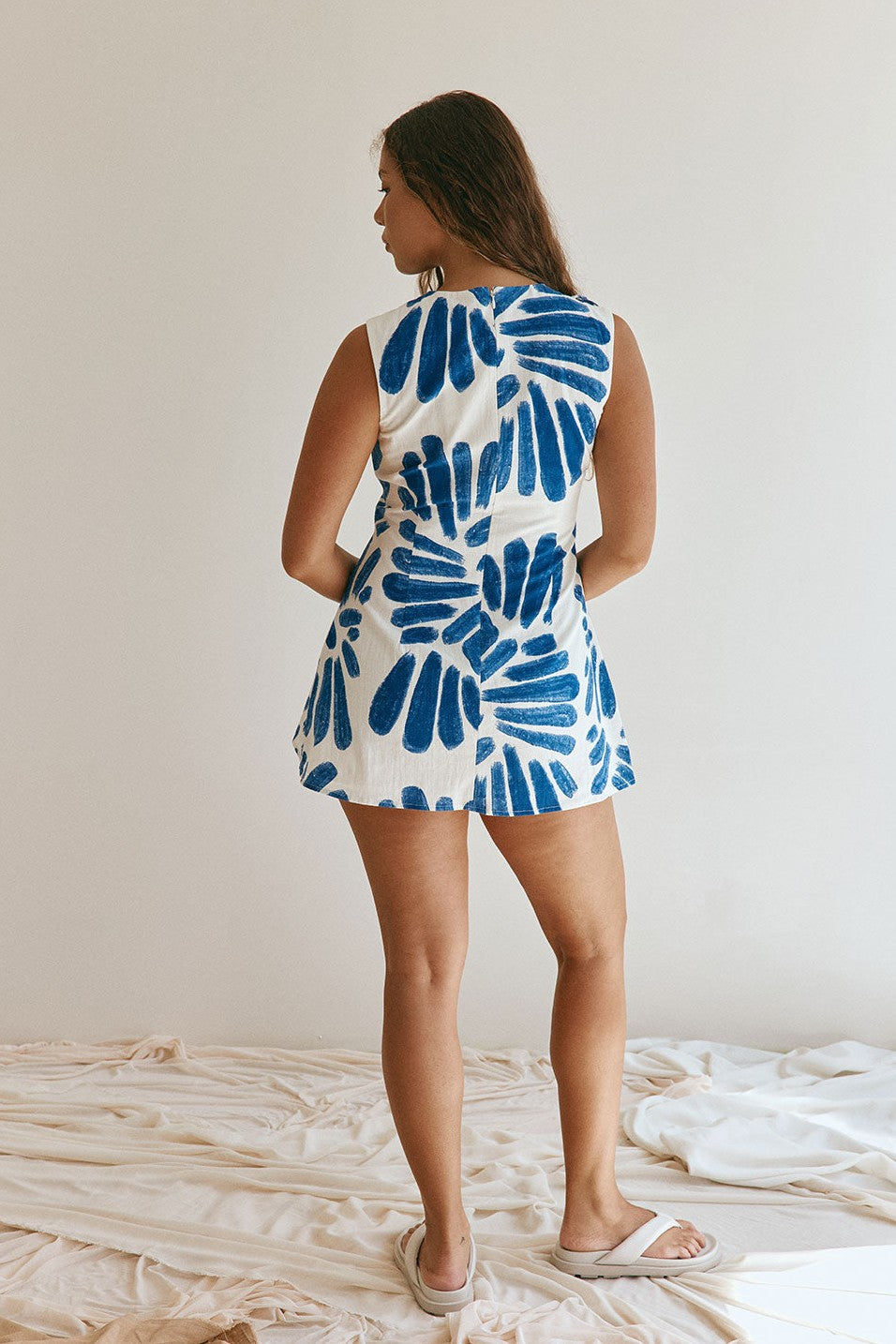 Blue mini dress with a round neckline, back view