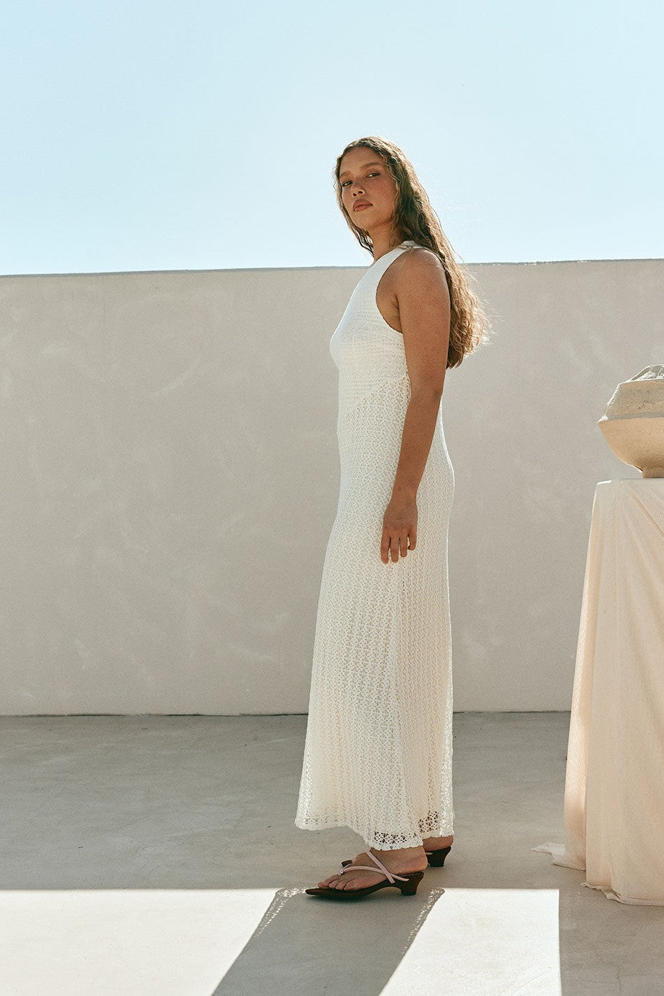 Cream maxi dress with an A-line skirt, styled on model