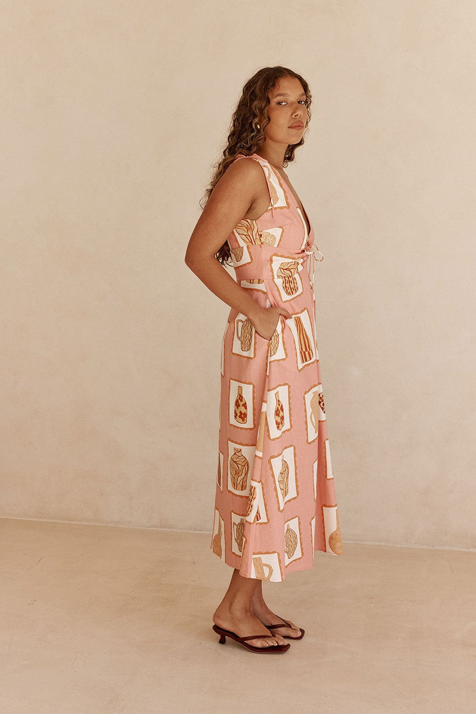 Pink midi dress with a V neckline, back view