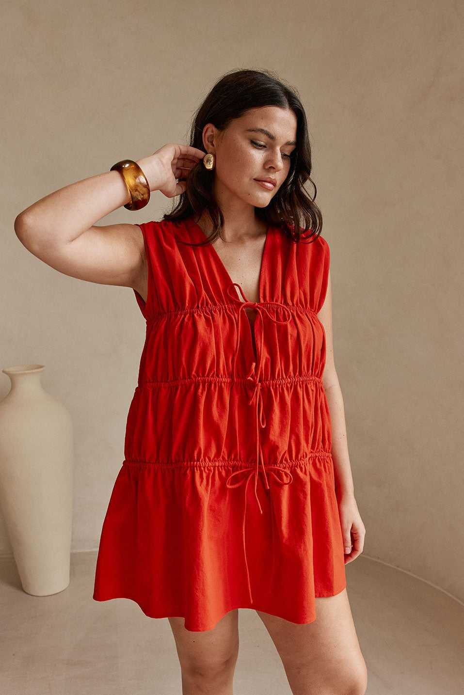 Red mini dress with a V neckline, side view