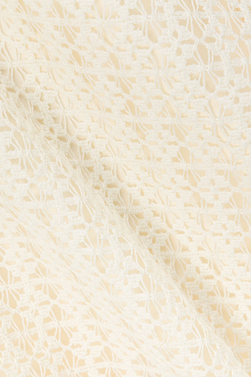 Cream maxi dress with an A-line skirt, side view
