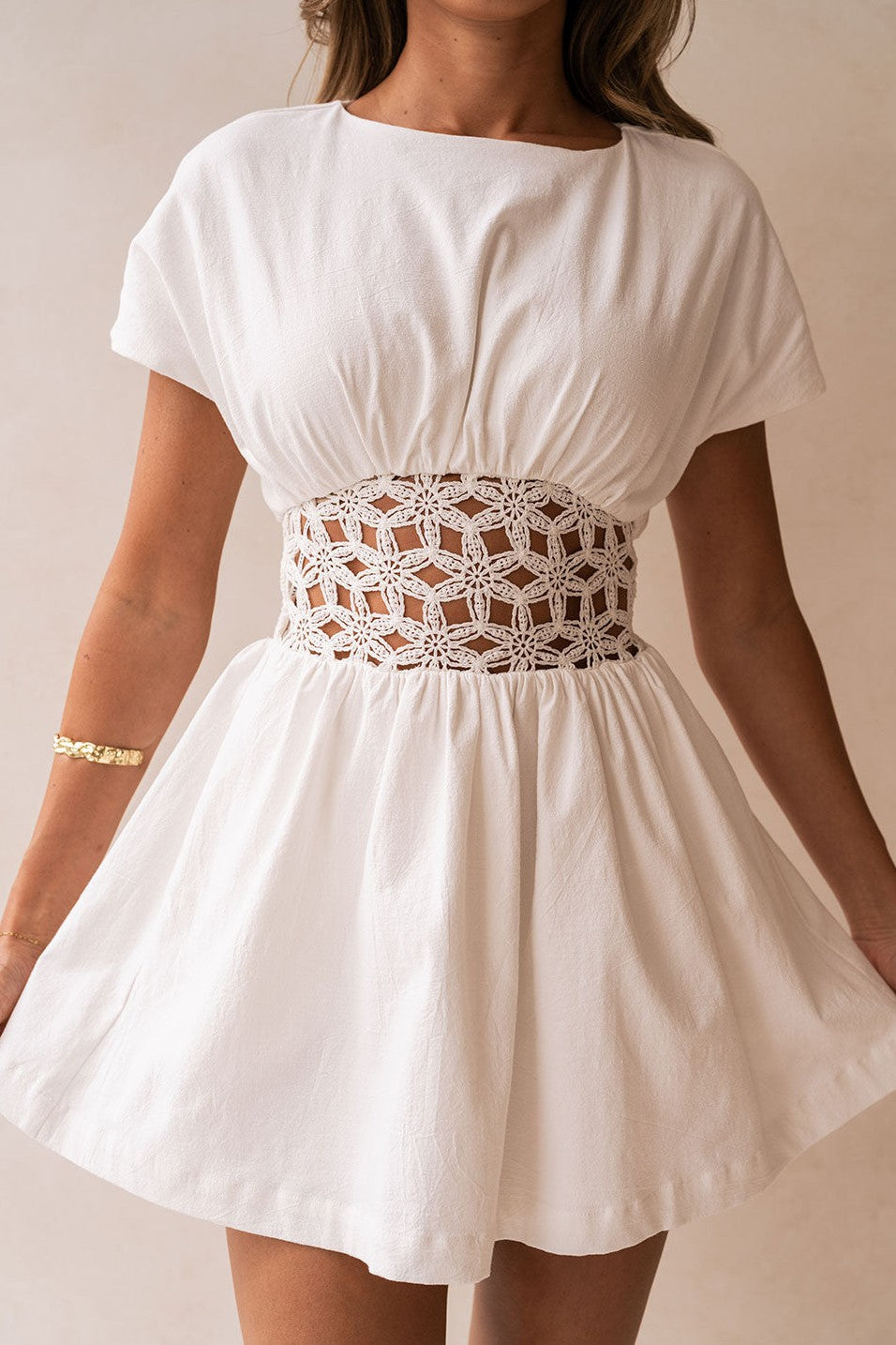 White mini dress with a boat neckline, front view