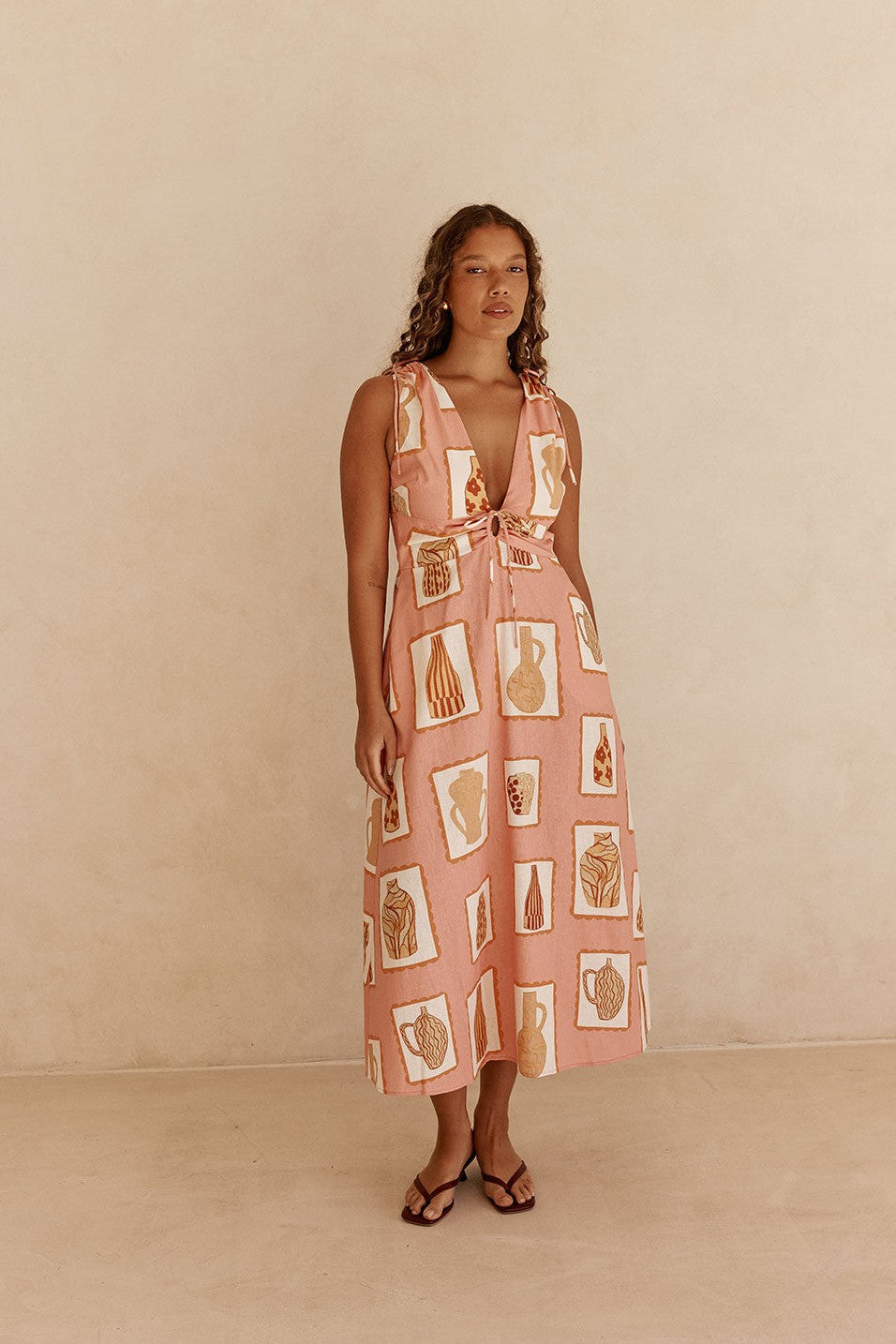 Pink midi dress with a V neckline, back view