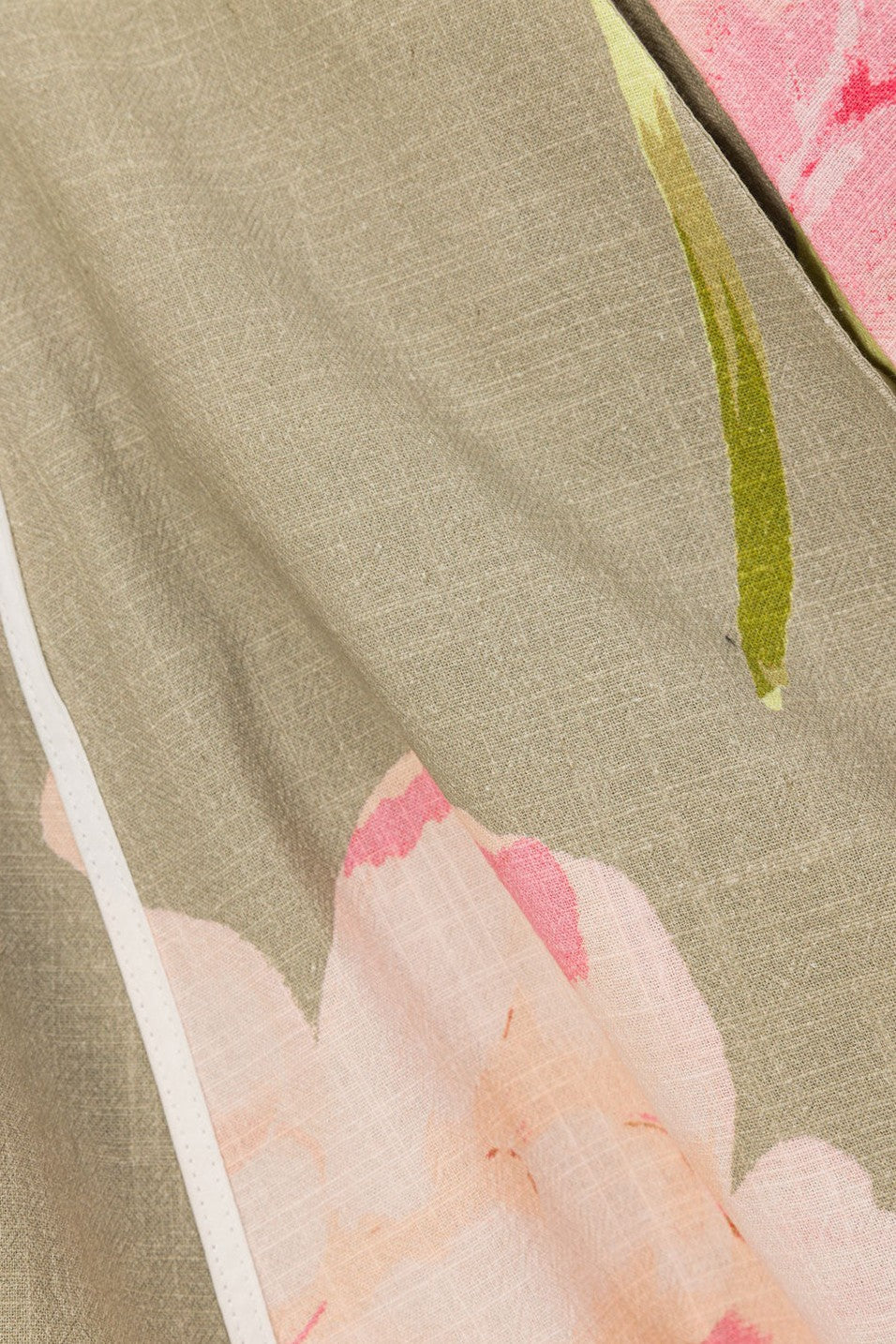Green mini dress with a boat neckline, detail view