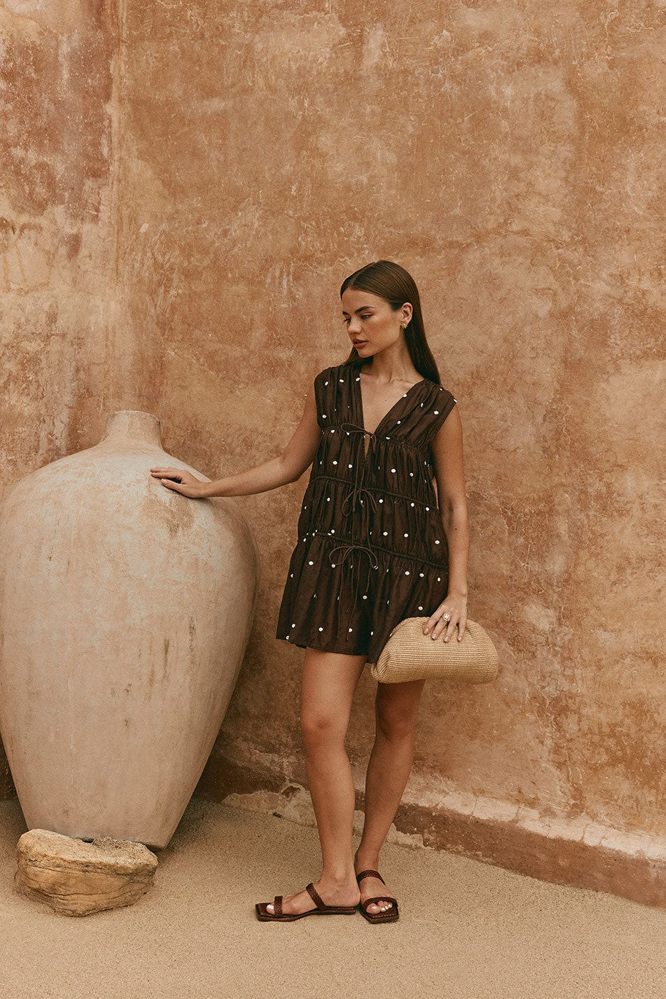 Brown mini dress with a V neckline, side view