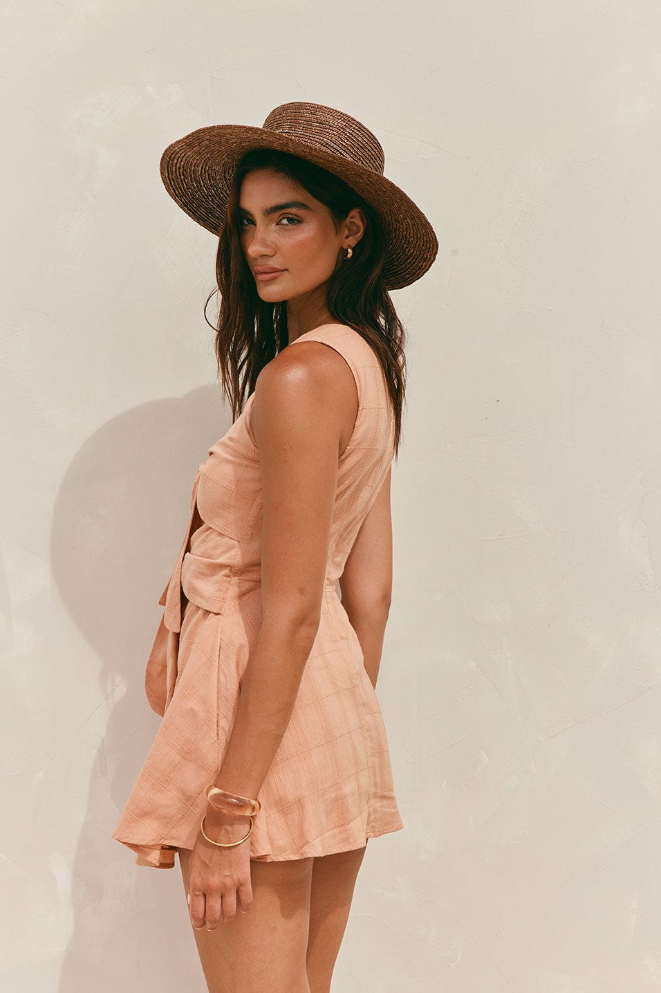 Orange mini dress with a V neckline, styled on model