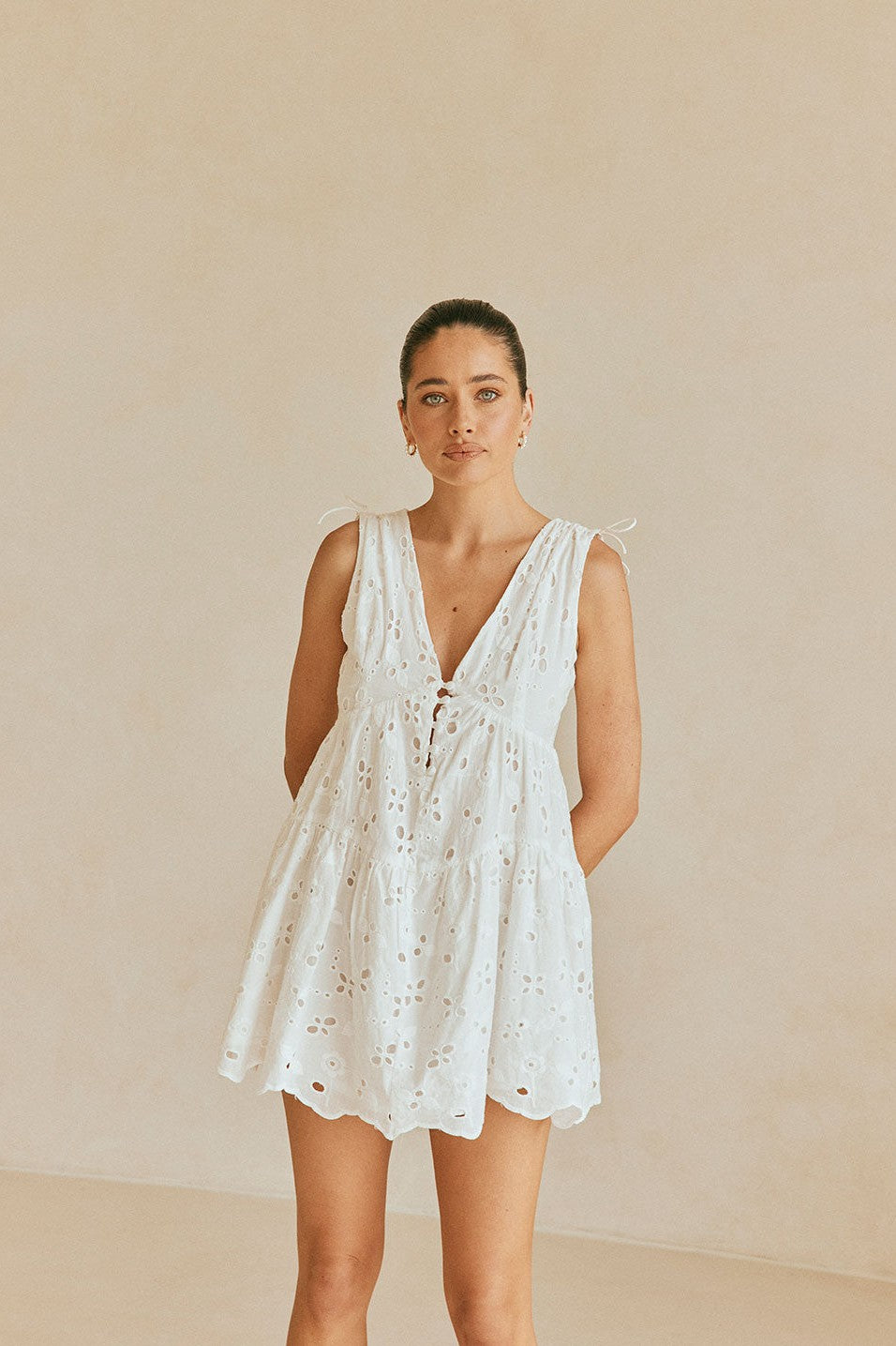 White mini dress with a V neckline, front view
