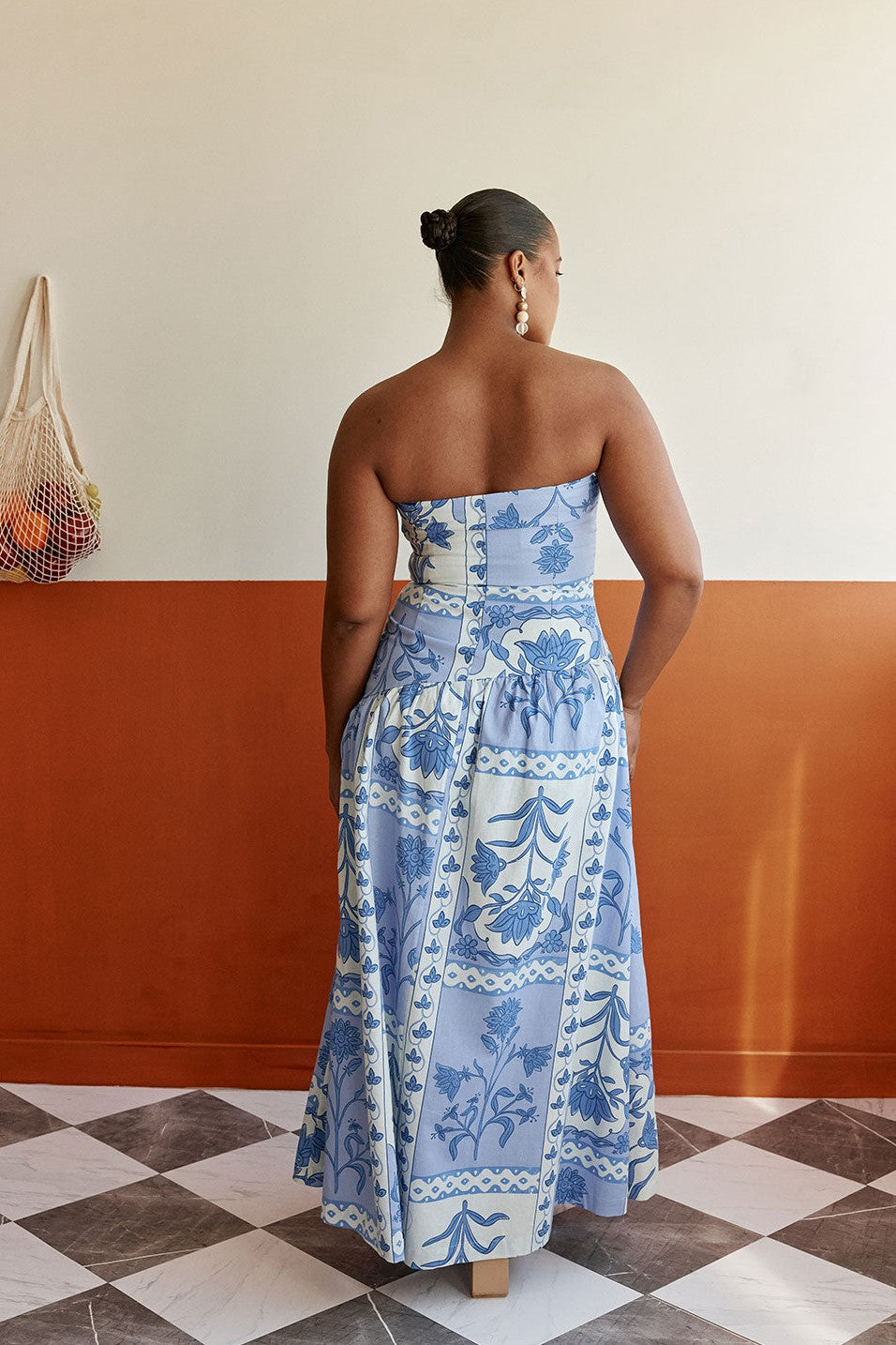 Blue maxi dress with a strapless neckline, front view