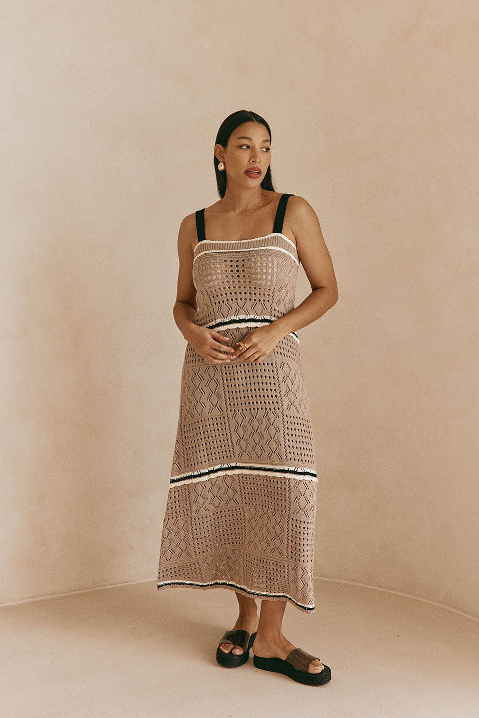 Brown maxi dress with an A-line skirt, detail view