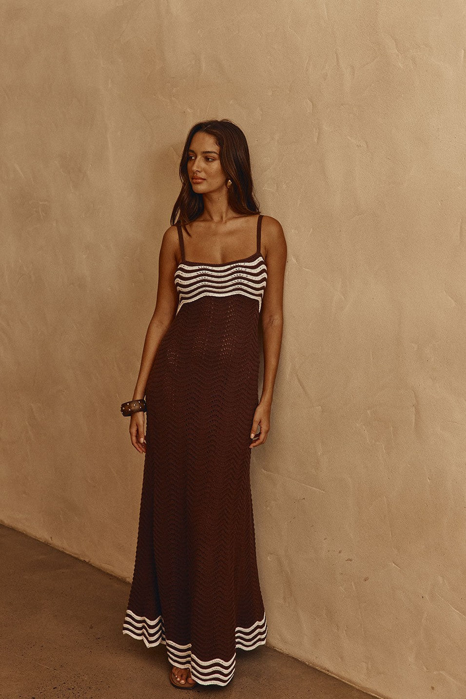 Brown maxi dress with a round neckline, back view