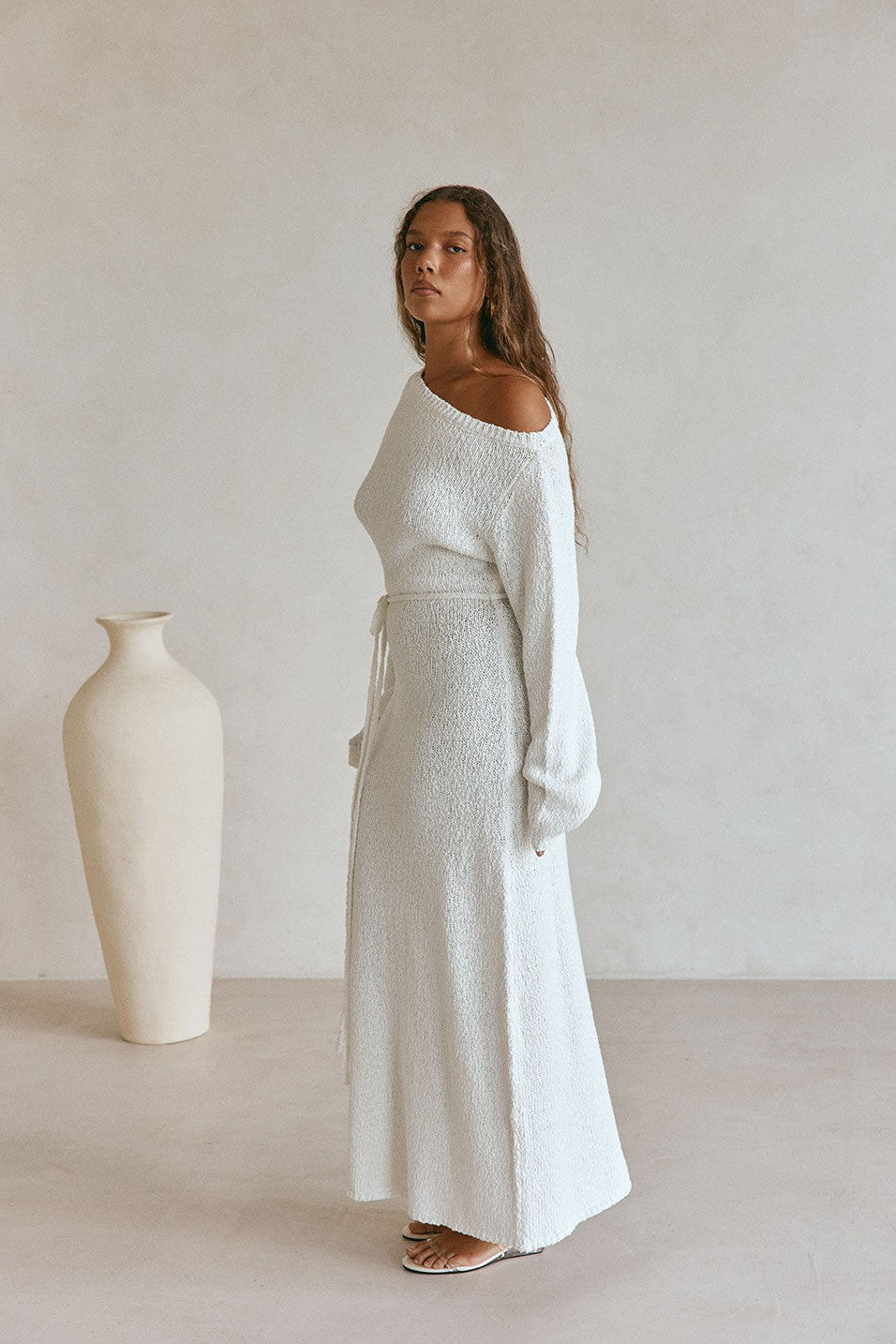 White maxi dress with an A-line skirt, styled on model