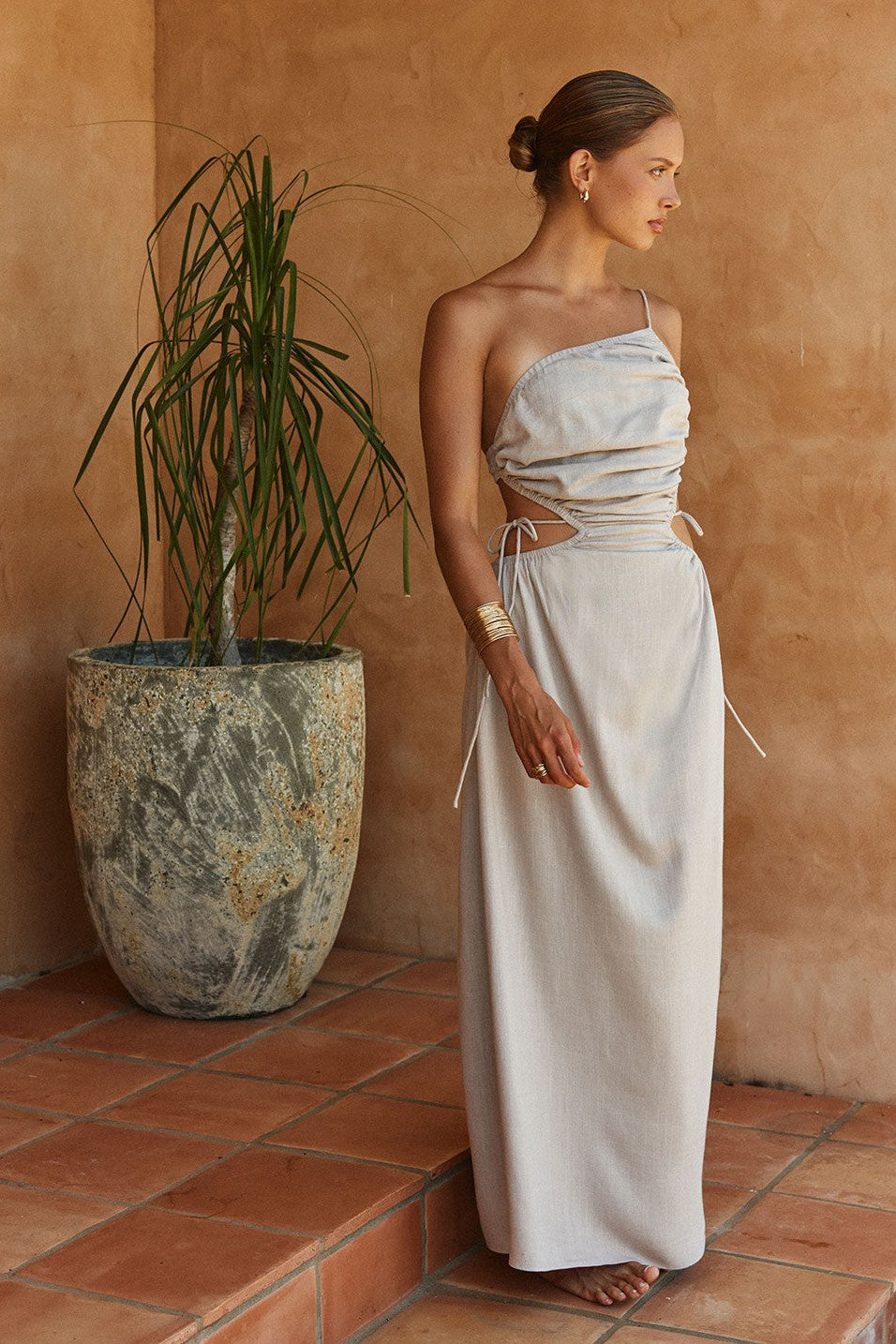 Grey maxi dress with an open back, detail view