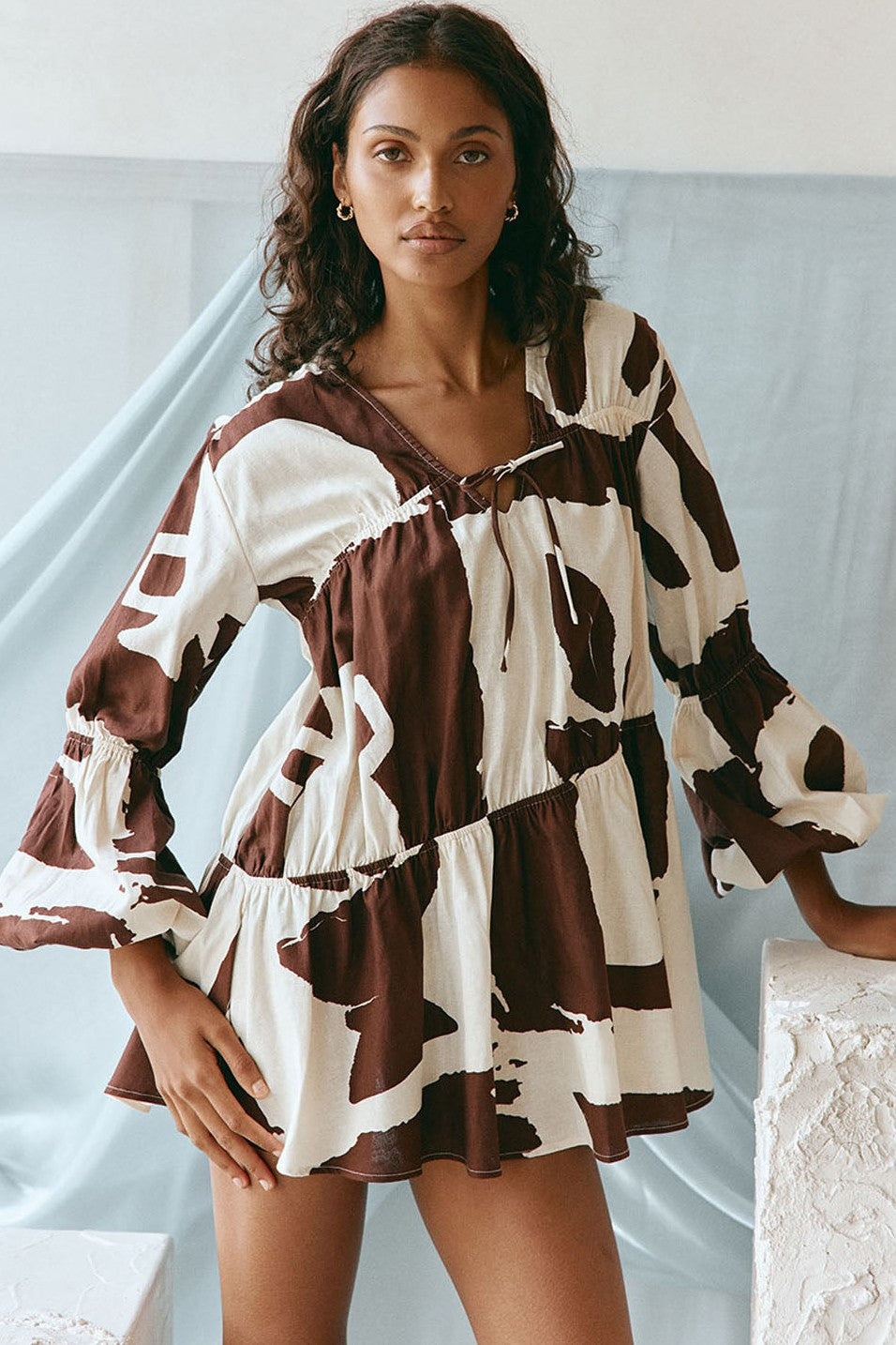 Brown mini dress with a V neckline, front view
