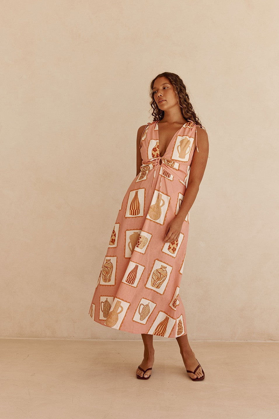 Pink midi dress with a V neckline, front view