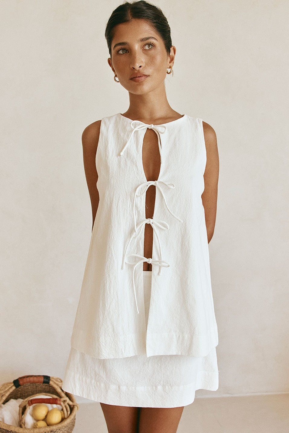 White mini dress with a side split, back view