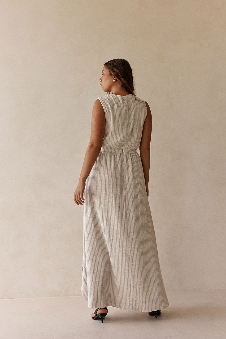 Beige maxi dress with a wrap silhouette, front view