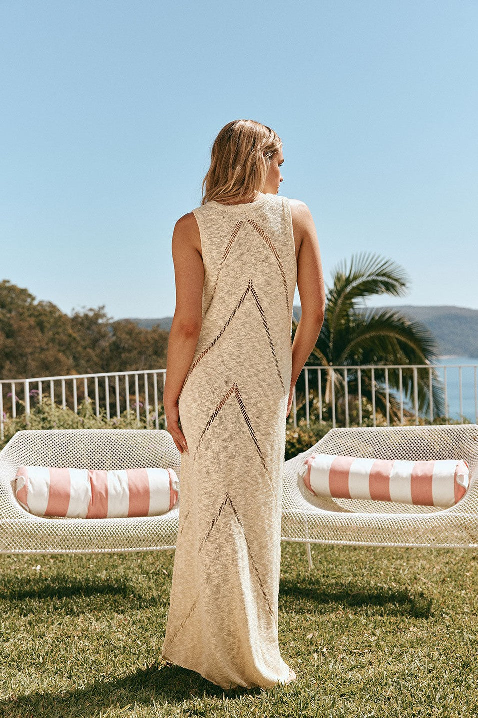 Yellow maxi dress with a strapless neckline, styled on model