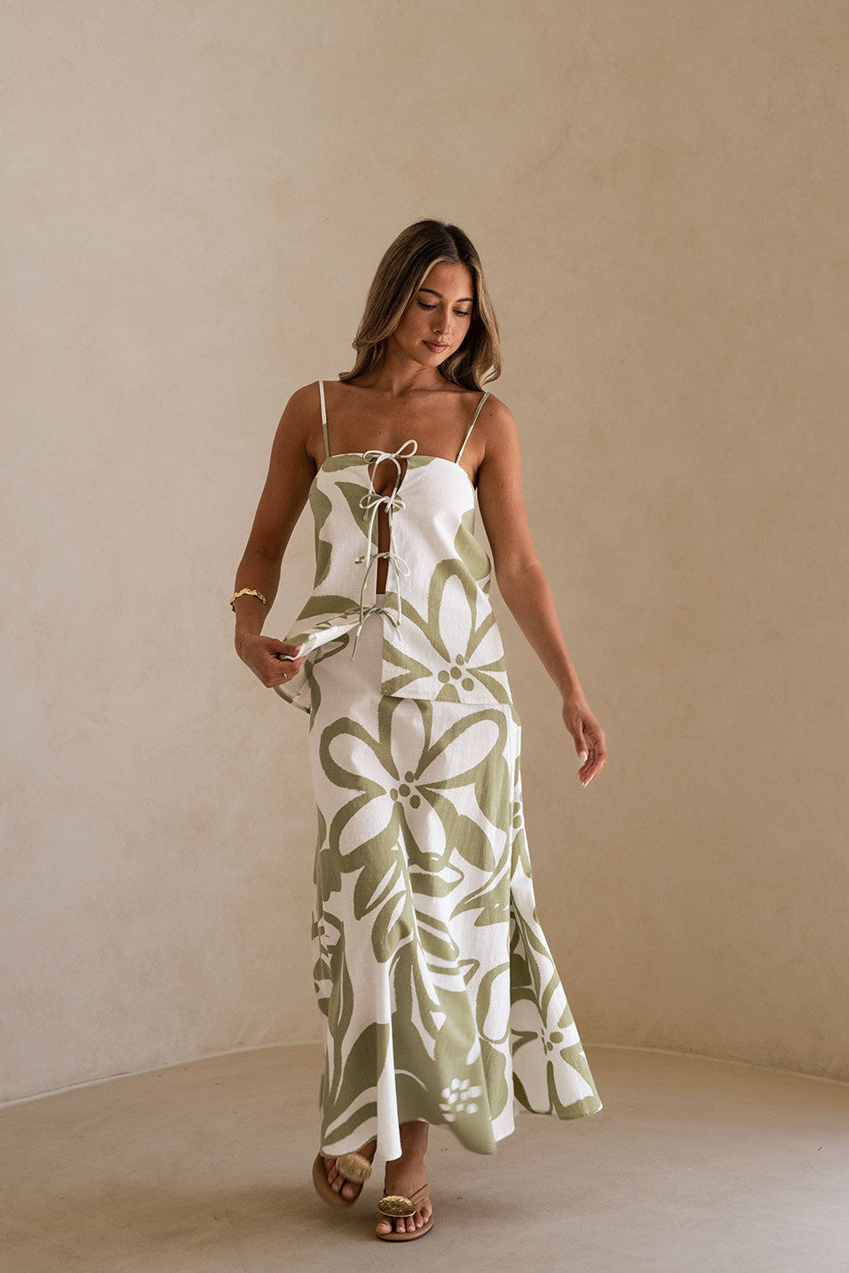 Green maxi dress with an A-line skirt, styled on model