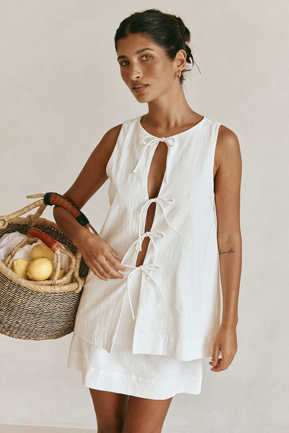 White mini dress with a side split, front view