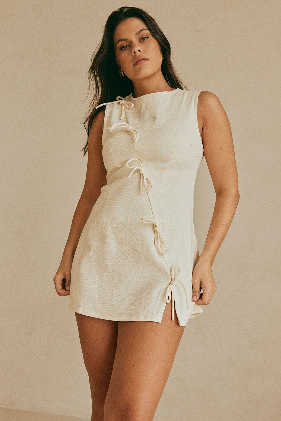 Cream mini dress with an A-line skirt, back view