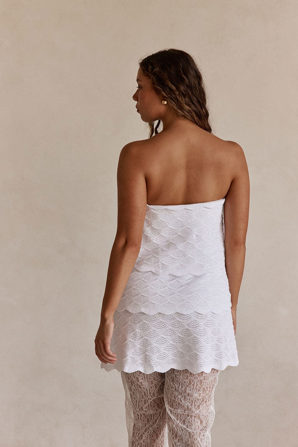 White mini dress with a strapless neckline, detail view
