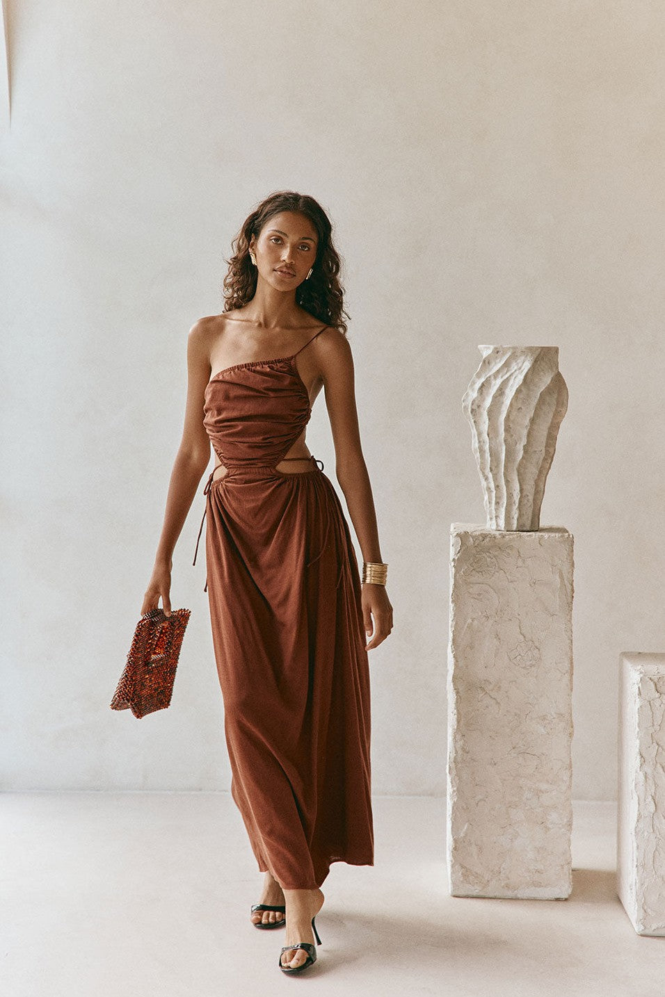 Brown maxi dress with an open back, front view