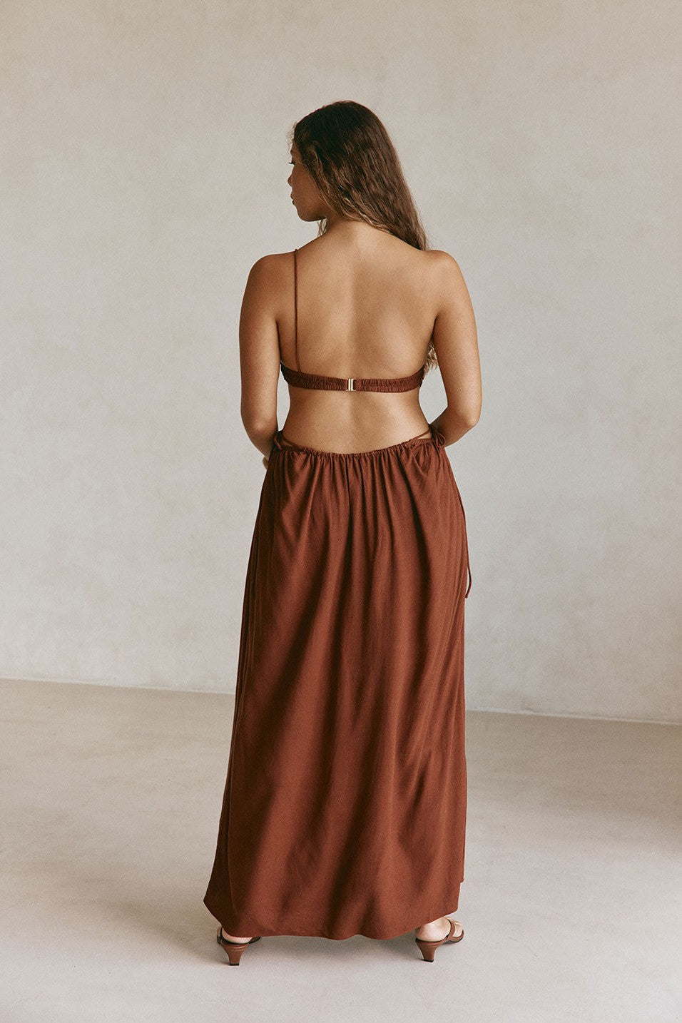 Brown maxi dress with an open back, back view