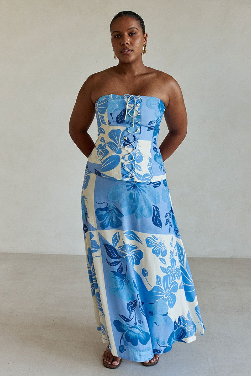 Blue maxi dress with a strapless neckline, side view