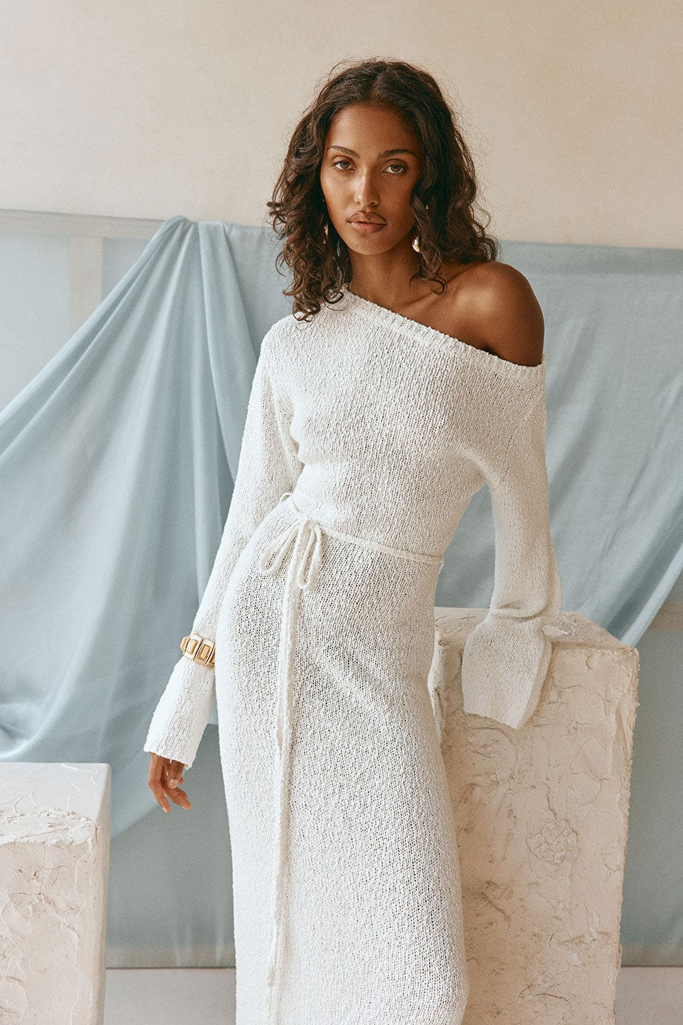 White maxi dress with an A-line skirt, side view