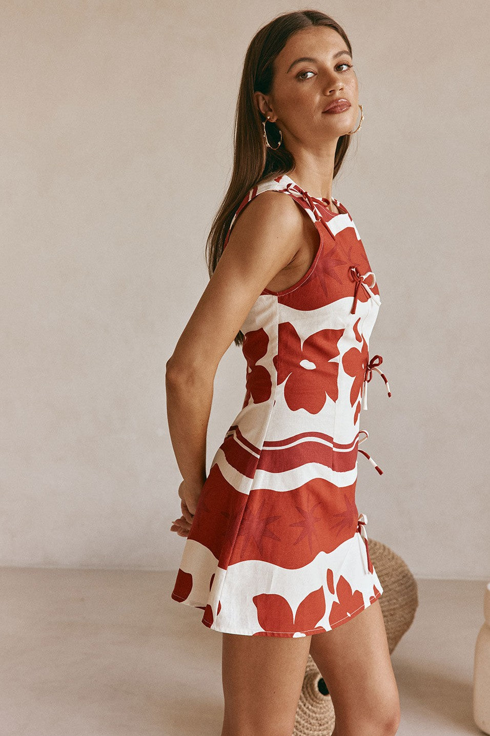 Red mini dress with a round neckline, styled on model